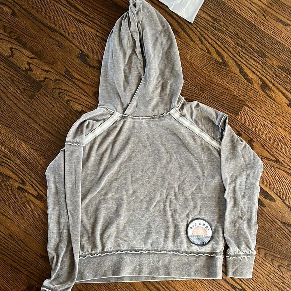 grey rip curl sweatshirt.